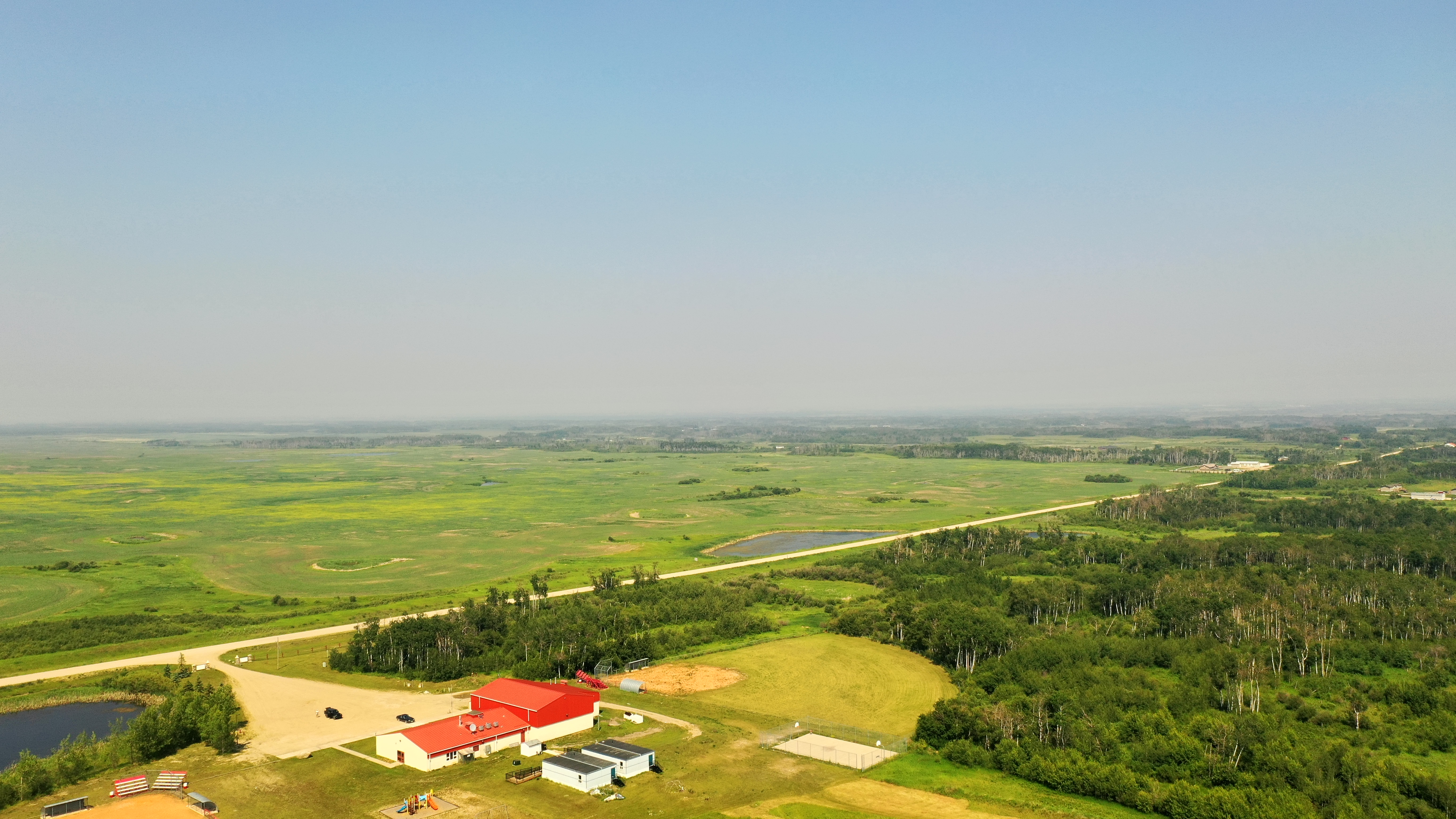 Okanese land and valley surrounding the school